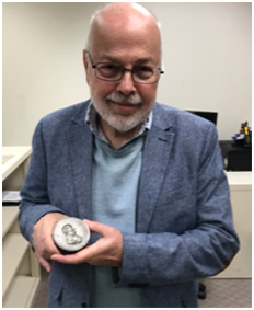 Mel Wacks Holding Sexias Medal